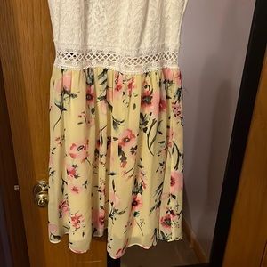 Size 9 dress in girls juniors. It is half white and half multicolored.